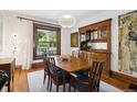 Formal dining room with a wooden table set and a classic built-in cabinet at 1007 N Ogden St, Denver, CO 80218