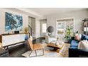 Comfortable living room with modern decor, a stylish credenza, and a blue velvet sofa at 801 8Th St, Golden, CO 80401