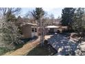 House with a large backyard and a two-car garage at 8010 W Chestnut Dr, Littleton, CO 80128