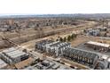 Aerial view showcasing new townhouse construction within a vibrant urban neighborhood with mature trees and a playground at 1239 Tennyson St # 10, Denver, CO 80204