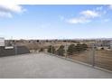 Enjoy city views from this spacious rooftop deck with metal railings at 1239 Tennyson St # 10, Denver, CO 80204