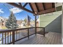 A view from the covered porch, showcasing the neighborhood and providing a glimpse of the community at 27 Buckthorn Dr, Littleton, CO 80127