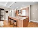Spacious kitchen island with granite counters, stainless steel appliances, and modern pendant lighting at 7600 Landmark Way # 904, Greenwood Village, CO 80111