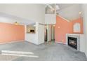 Spacious living room with a fireplace and vaulted ceiling at 1805 W 101St Ave, Thornton, CO 80260