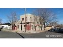 Two-story home featuring a flat roof, stucco siding, with street and neighborhood views at 3700-3704 Osage St, Denver, CO 80211