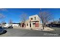 Two-story home featuring a flat roof, stucco siding, with street and neighborhood views at 3700-3704 Osage St, Denver, CO 80211