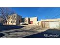 Two-story home featuring a flat roof, stucco siding, with street and neighborhood views at 3700-3704 Osage St, Denver, CO 80211