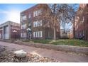 Side view of the apartment building, showing its classic architecture and a small yard at 1341 N Washington St # 4, Denver, CO 80203