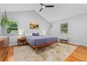 Serene main bedroom featuring wood floors, vaulted ceiling, neutral tones, and ample natural light at 3765 E Easter Dr, Centennial, CO 80122
