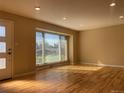 Bright living room featuring hardwood floors and large window at 6176 S Adams Dr, Centennial, CO 80121