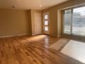 Inviting living room boasting hardwood floors, bright light, and a welcoming entryway at 6176 S Adams Dr, Centennial, CO 80121