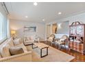 Comfortable living room with hardwood floors, neutral color scheme, and stylish furnishings and decor at 806 S Jersey St, Denver, CO 80224