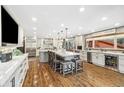 Spacious kitchen with a granite island, stainless appliances, hardwood floors, and lots of cabinet space at 2140 Torrey Pine Dr, Evergreen, CO 80439