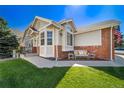 Charming home with a well-manicured lawn and a cozy front porch with decorative elements at 3104 Newport Cir, Castle Rock, CO 80104