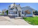 Inviting condo exterior featuring a private entrance and well-kept landscaping at 17003 E Tennessee Dr # 209, Aurora, CO 80017