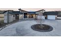Attractive exterior showcasing architectural design with stone accents and a circular driveway at 19647 Guildford Ct, Monument, CO 80132