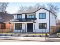 Charming two-story home boasting a modern design with manicured yard and fence at 4647 Bryant St, Denver, CO 80211