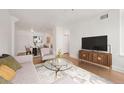 Cozy living room with comfortable seating, a modern TV console, and stylish decor at 444 17Th St # 802, Denver, CO 80202