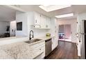 Well-lit kitchen with granite countertops, stainless steel appliances, and ample cabinet space for storage at 1825 S Pitkin Cir # 10, Aurora, CO 80017