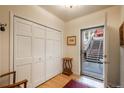 Inviting entryway with closet, hardwood floors, and convenient access to the outdoors at 4192 Timbervale Dr, Evergreen, CO 80439