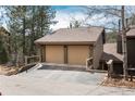 Spacious two-car garage with ample driveway parking, providing convenient and secure vehicle storage at 4192 Timbervale Dr, Evergreen, CO 80439