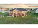 A vast backyard accents this lovely home featuring a walkout basement and deck at 29303 E 165Th Ave, Brighton, CO 80603