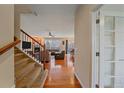 Inviting living room featuring gleaming hardwood floors and a cozy fireplace at 6461 S Ider St, Aurora, CO 80016