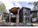 Luxury home featuring a pool, outdoor kitchen and extensive balconies with stunning architectural details at 1070 Cypress Way, Castle Rock, CO 80108