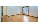 Bright bedroom with hardwood floors, offering a clean and modern look at 2603 W 100Th Pl, Denver, CO 80260
