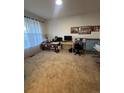 Neutral bedroom featuring beige carpet, and lots of space for an office at 14241 Ivanhoe St, Thornton, CO 80602