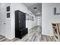 Spacious hallway with built-in storage, stylish decor, and seamlessly transitions into the main living area at 802 Eva Peak Dr, Erie, CO 80516