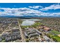 Panoramic aerial view of the neighborhood featuring mature trees, a serene lake, and mountain views at 1717 Irving St, Denver, CO 80204