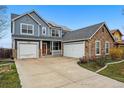 Spacious home boasts three-car garage and stone details for added curb appeal at 13686 Dexter St, Thornton, CO 80602