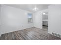 Bright living room with laminate floors and natural light at 3715 N Jackson St, Denver, CO 80205