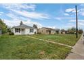 Residential street view featuring multiple houses and lawns at 3715 N Jackson St, Denver, CO 80205