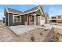 Beautiful home featuring an inviting entryway and meticulously landscaped front yard with stone accents at 308 Josef Cir, Fort Lupton, CO 80621