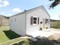 Cozy home featuring fresh exterior paint, decorative shutters, and a well-maintained lawn at 9180 Spruce Mountain Rd, Larkspur, CO 80118