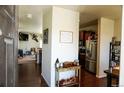 Inviting entryway with hardwood floors and decor, leading to an open living space at 541 Park Blvd, Brighton, CO 80603