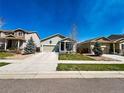 A view of the home in its neighborhood, showcasing its well-maintained lawn and siding at 541 Park Blvd, Brighton, CO 80603