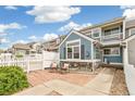 Back exterior showcasing a stone patio and charming curb appeal at 11386 Grove St # B, Westminster, CO 80031