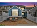 Cozy outdoor seating area with stone patio, perfect for relaxing evenings at 11386 Grove St # B, Westminster, CO 80031