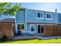 Inviting two-story home featuring a private patio and neat landscaping for great curb appeal at 7933 Chase Cir # 182, Arvada, CO 80003