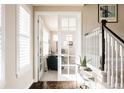 Bright home office with French doors, offering a quiet workspace at 9575 E 3Rd Pl, Denver, CO 80230