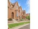 Charming townhomes with well-manicured lawns and gardens, creating a welcoming curb appeal at 18061 E Saskatoon Pl, Parker, CO 80134