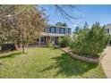 Charming two story home with lovely, green front lawn and manicured shrubbery adding to the curb appeal at 9926 W Nova Pl, Littleton, CO 80127