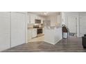 Bright kitchen with white cabinets, stainless steel appliances, and granite countertops at 5550 W 80Th Pl # 1, Arvada, CO 80003