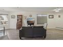 Bright living room with wood-look floors, large windows, and a comfortable layout at 5550 W 80Th Pl # 1, Arvada, CO 80003