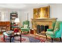 Cozy living room features a stone fireplace, comfortable seating, and elegant décor at 334 Ivy St, Denver, CO 80220