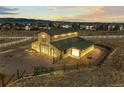 Rural barn and farmland set against a distant city and mountain backdrop with an expansive view at 10963 N Chatfield Dr, Littleton, CO 80125