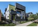 Modern home with unique architectural details, a fenced yard, and professional landscaping at 3453 Navajo St, Denver, CO 80211